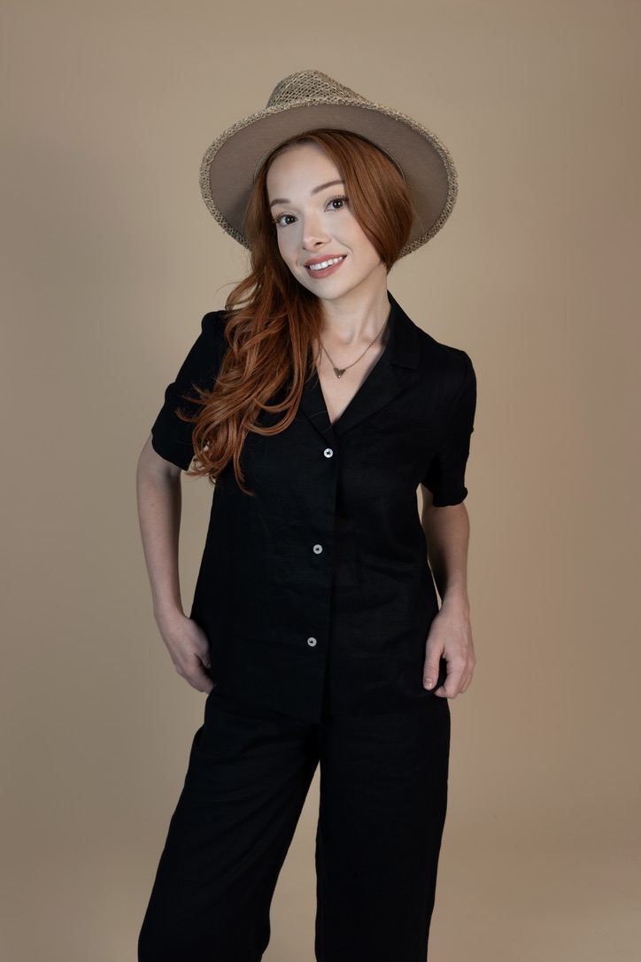 Courtney Sardana modeling a black linen look and hat