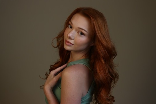 Courtney Sardana in a soft green portrait