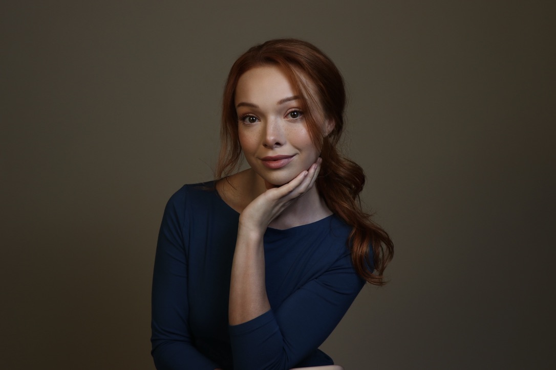 Courtney Sardana in a blue character portrait
