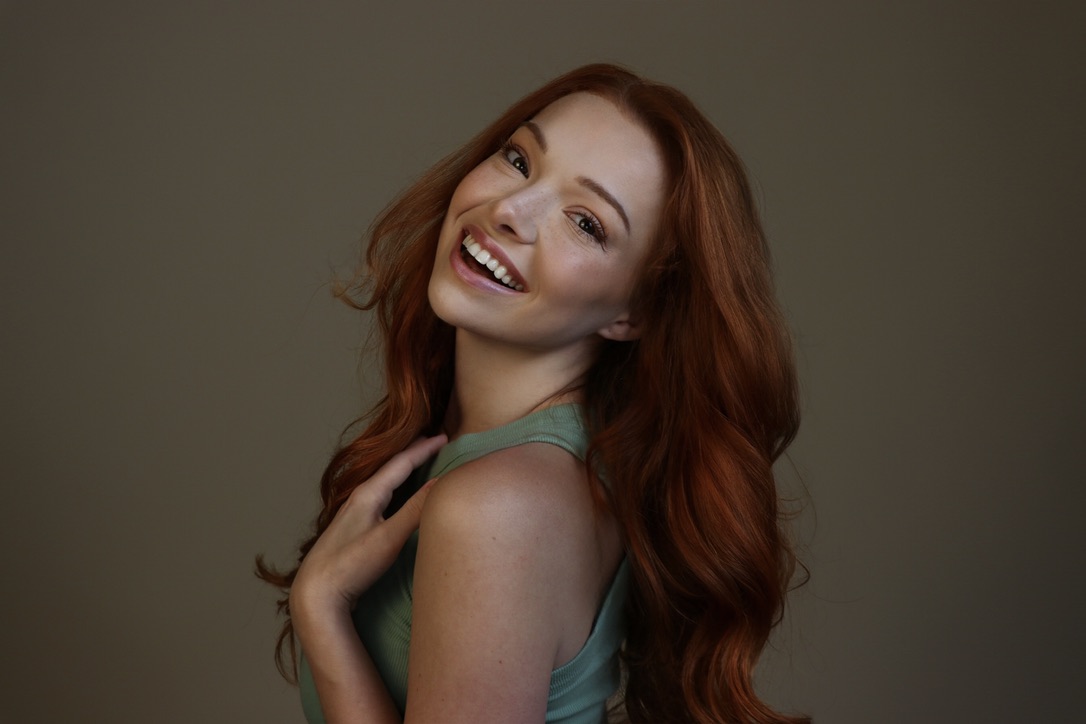 Courtney Sardana laughing in a green top