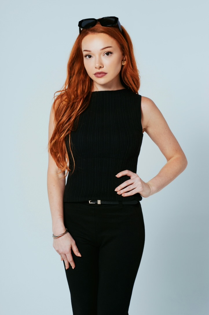Courtney Sardana modeling a black sleeveless look
